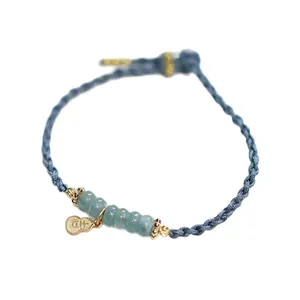 Naturblaue Eis-Jade-Perle Armband mit handgewebter blauer Kordel und goldenem Kürbis