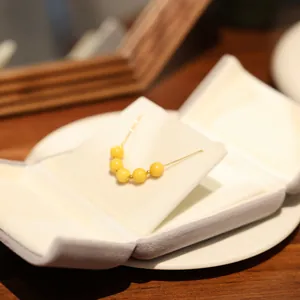 Detail of amber bead necklace displayed in a premium velvet jewelry storage box