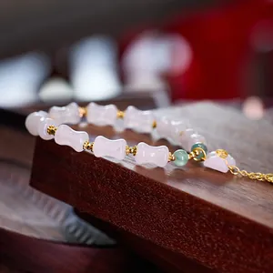 Bamboo-style purple jade bracelet with gold spacers and green beads for women