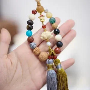 Buddhist mala beads pendant with colorful natural stones, carved lotus and silk tassels
