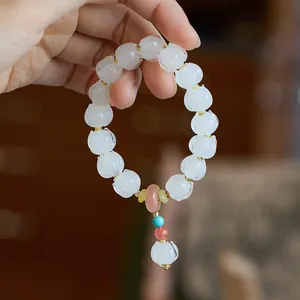 Elegant lily of the valley beaded bracelet with purple fluorite and peace buckle charm