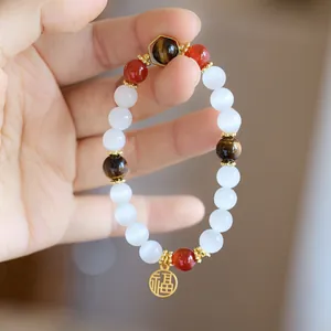 Cat eye and tiger eye stone beaded bracelet with gold Fu pendant for good luck and fortune