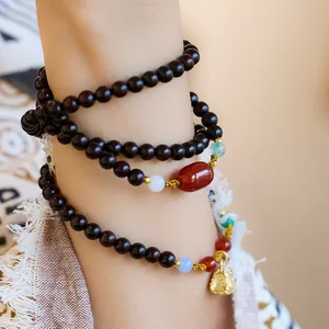 Authentic sandalwood 108 beads bracelet with red agate and a small gold Buddha pendant
