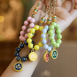 Five-color porcelain bead phone charms with golden religious pendants and silk knots