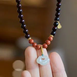 Red sandalwood necklace with green Hetian jade Ruyi lock pendant in Chinese style