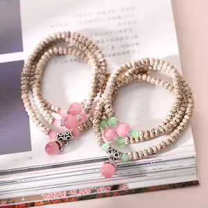 Natural Bodhi Seed Wrap Bracelet with Cat Eye Stones and Ornate Silver Metal Charms