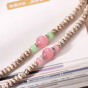 Star Moon Bodhi Seed bracelet with pink cat eye stones and sparkling metal spacers