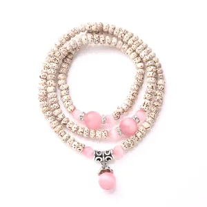 Star Moon Bodhi Seed Bracelet with pink cat eye stones and vintage metal charms