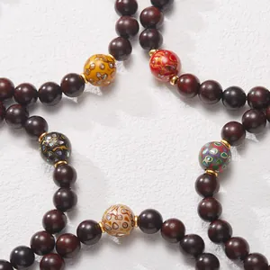 Natural red sandalwood bracelet with multi-colored gemstone beads in star arrangement