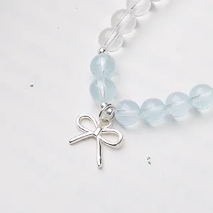 Bracelet en perles argent S925 avec aigue-marine, cristal blanc et breloque noeud