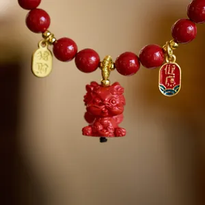 Red cinnabar car charm with dragon pendant and lucky gold tags for health and wealth