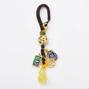 Traditional Chinese amber gourd keychain with golden dragon charms and good luck tags
