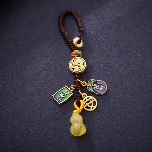 Traditional Chinese dragon keychain with amber gourd pendant and auspicious charms