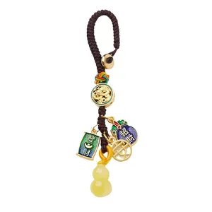 Chinese temple lucky keychain with woven cord, amber resin gourd, and fortune charms