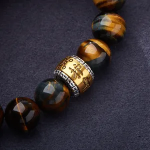 Natural yellow and blue tiger eye stone bracelet with golden engraved lucky bead