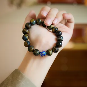 Natural tiger eye stone bracelet with blue cloisonne bead and six-word mantra engraving