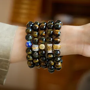 Natural yellow blue tiger eye stone bead bracelet set with silver and gold charms