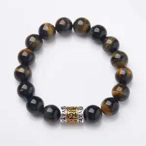 Natural tiger eye stone bead bracelet featuring a silver metal charm and golden mantra symbols