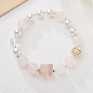 Handmade rose quartz and fluorite lion bracelet with pearls and gold accents