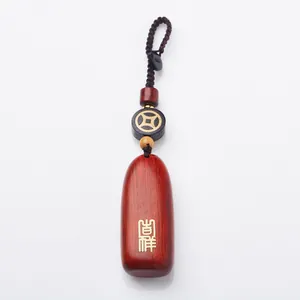 Traditional rosewood car keychain with auspicious calligraphy and woven cord pendant
