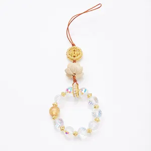 Pendentif fleur de lotus en buis avec cristaux colorés et cordon tressé marron