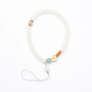 Natural Bodhi Seed mobile phone strap with white beads and green aventurine flower decor
