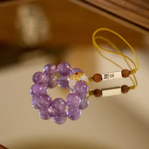 Handmade amethyst phone charm with yellow braided strap and lucky symbol metal tag
