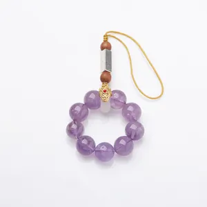 Handmade amethyst phone charm with purple crystal beads and yellow braided strap