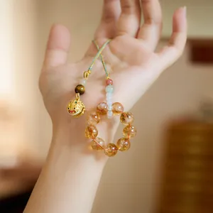 Natural yellow quartz bead charm with a golden lion pendant and tiger eye stone