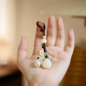 Chinese style Bodhi seed lucky bag keychain with bell and carved wooden flower pendant