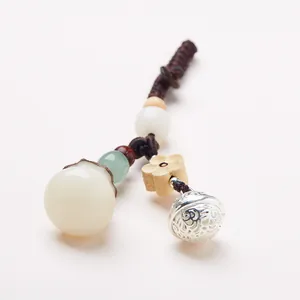 Chinese retro keychain with white jade bead, wood flower carving and silver bell charm