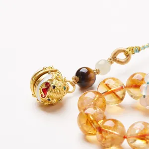 Natural yellow crystal car charm with tiger eye stone and golden lion head pendant