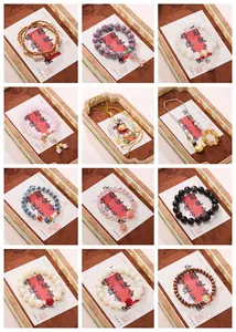 Assorted gemstone bead bracelets set with traditional Chinese lotus charms and tassels
