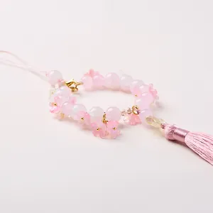 Handmade pink cherry blossom beaded charm with silk tassel and gold hook for bags