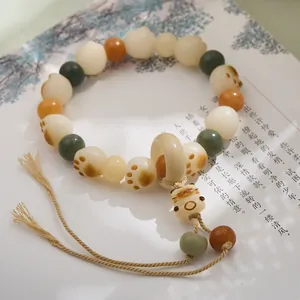 Handmade cat paw beaded bracelet with white jade bodhi seeds and cat pendant charm