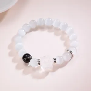 Bracelet élégant en œil de chat et obsidienne avec breloque de lion sculptée à la main