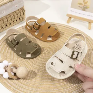 Close-up of soft PU baby sandals in various colors with size print and metal buckle detail