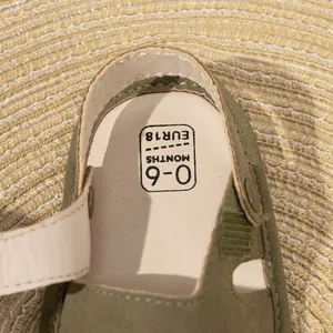 Detail shot of army green baby sandal footbed with size 18 and 0-6 months age mark