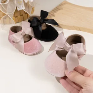 Close-up showing soft velvet baby princess shoes with large satin bows in three colors