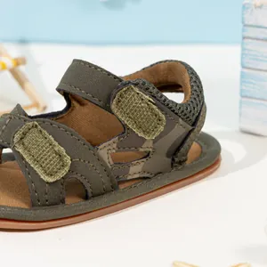 Detail of baby camouflage sandals with adjustable double hook and loop straps