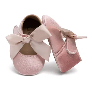 Pink velvet baby Mary Jane shoes with soft sole and large satin ribbon bow detail