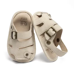 Detail of closed-toe baby sandals showing breathable hollow design and metal buckle adjustment
