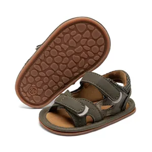 Close-up of baby camouflage sandals featuring brown rubber anti-slip pebble texture sole