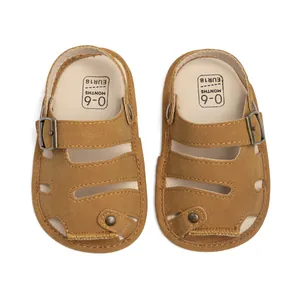 Detail view of baby brown PU leather sandals with adjustable metal buckle and size print