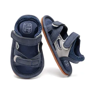Detail view of baby sandals with camouflage blue canvas and secure double velcro straps