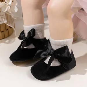 Infant girl Mary Jane walker shoes with black velvet finish and oversized ribbon bow
