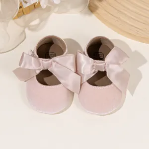 Pink velvet baby princess shoes with satin bow and soft soles for toddlers