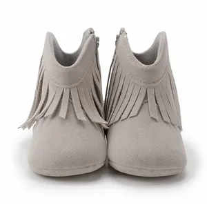 Detailed view of gray soft suede baby boots with decorative fringe and side zipper