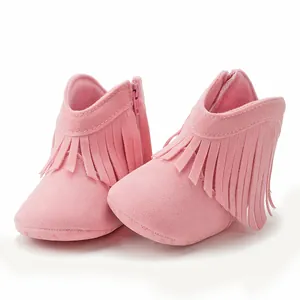 Detail of pink baby fringe boots with side zipper and soft sole for toddlers