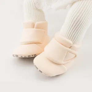 Detailed close-up of warm baby winter shoes with soft anti-slip soles and velcro straps